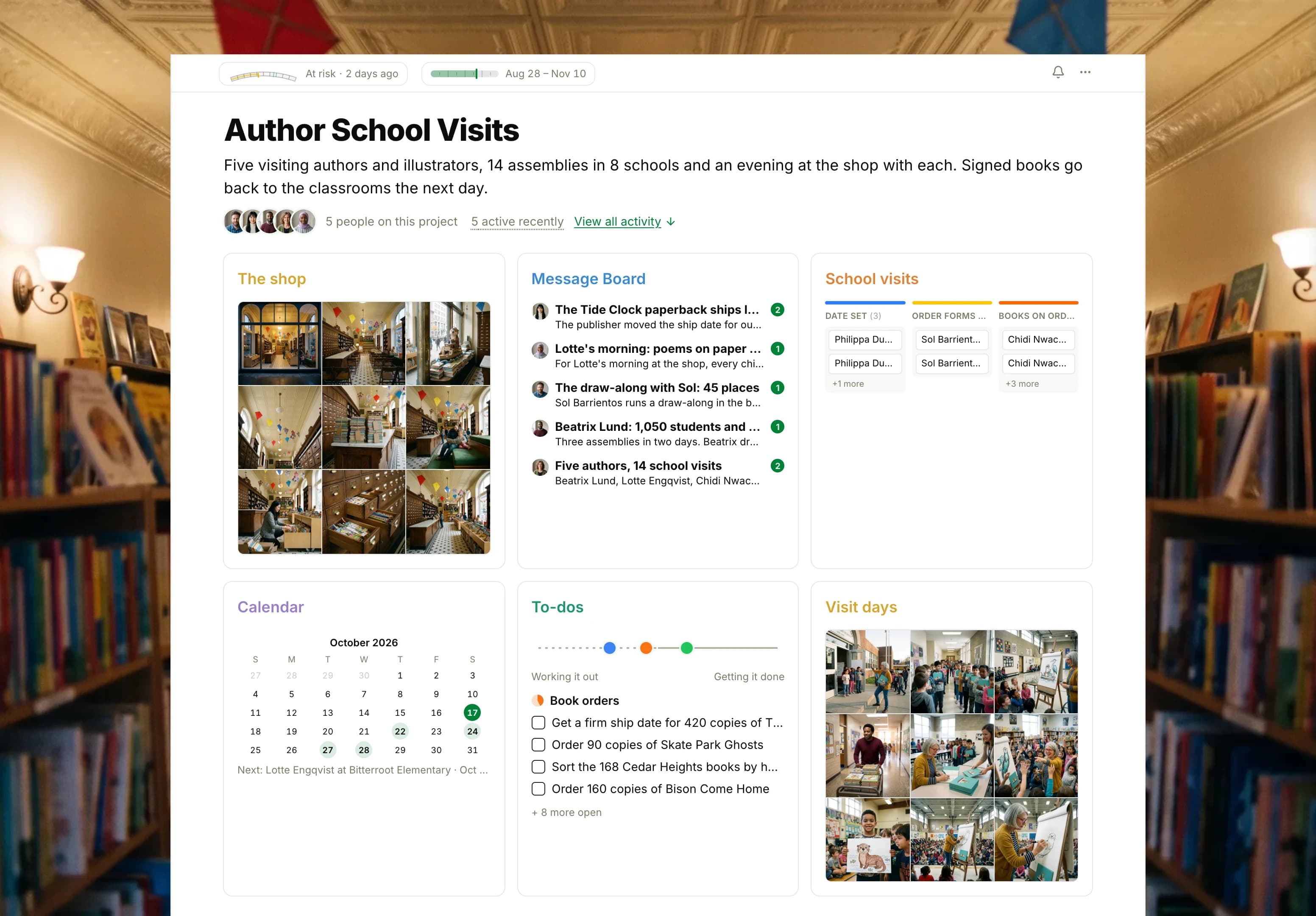 The Author School Visits project in Thicket over a photograph of a children's bookstore at dusk: the health flag reading Some risk, the project dates and five people, then six cards: The shop as nine photographs of the bookstore inside an old pharmacy, the Message Board with the late paperback on top, the School visits board with cards from Date set to Books in, the Calendar with the coming visits and evenings, To-dos with three lists on the progress chart, and Visit days as nine photographs of an illustrator drawing for schoolchildren.