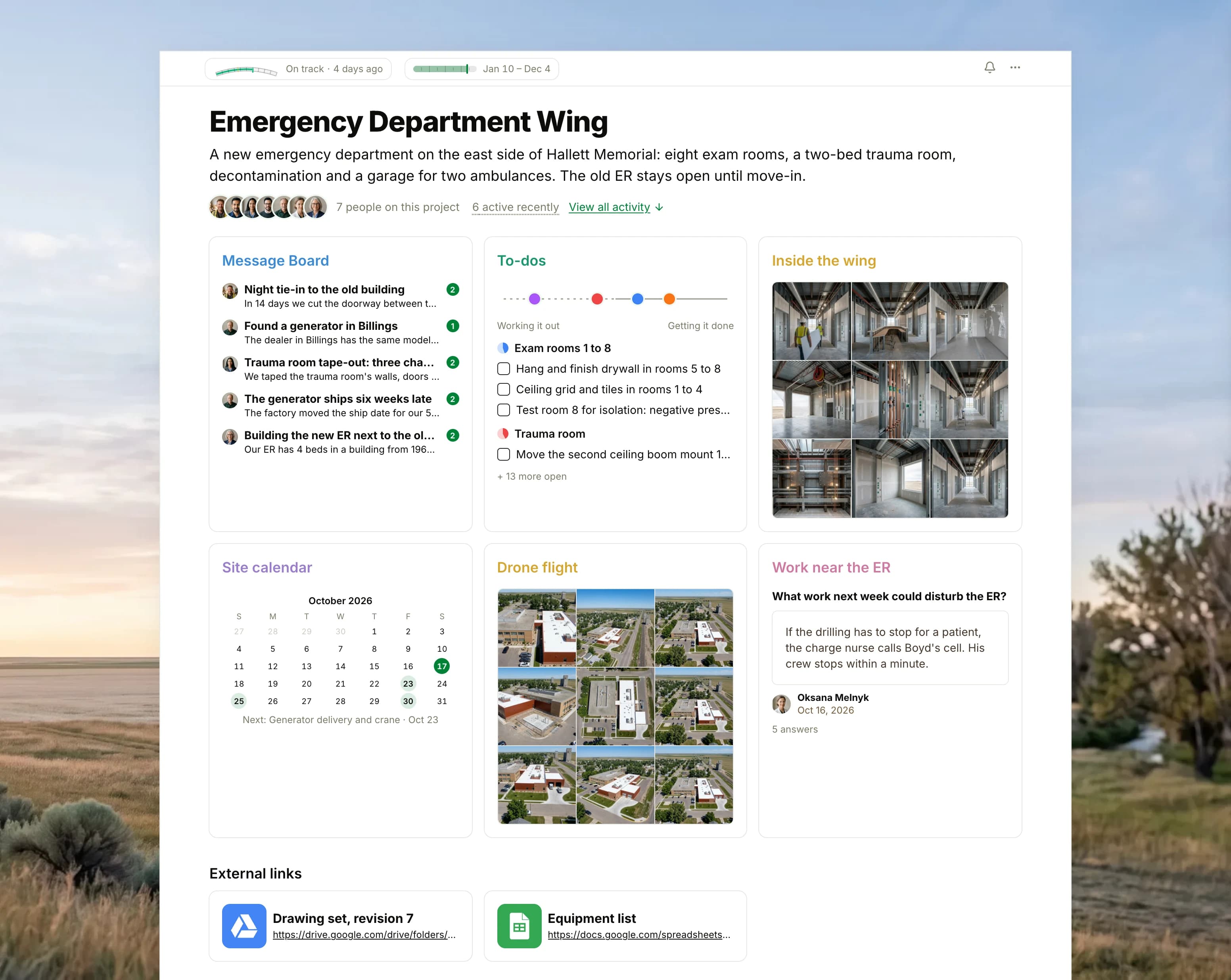 The Emergency Department Wing project in Thicket over a photograph of open prairie at sunrise: the health flag reading On track, the build's dates and seven people, then six cards: the Message Board with the night tie-in plan on top, To-dos with four lists on the progress chart, Inside the wing as nine photographs of the rooms under construction, the Site calendar with the generator delivery next, Drone flight as nine aerial photographs of the hospital and its new wing, and the Work near the ER check-in with this week's answers, with two external links below.